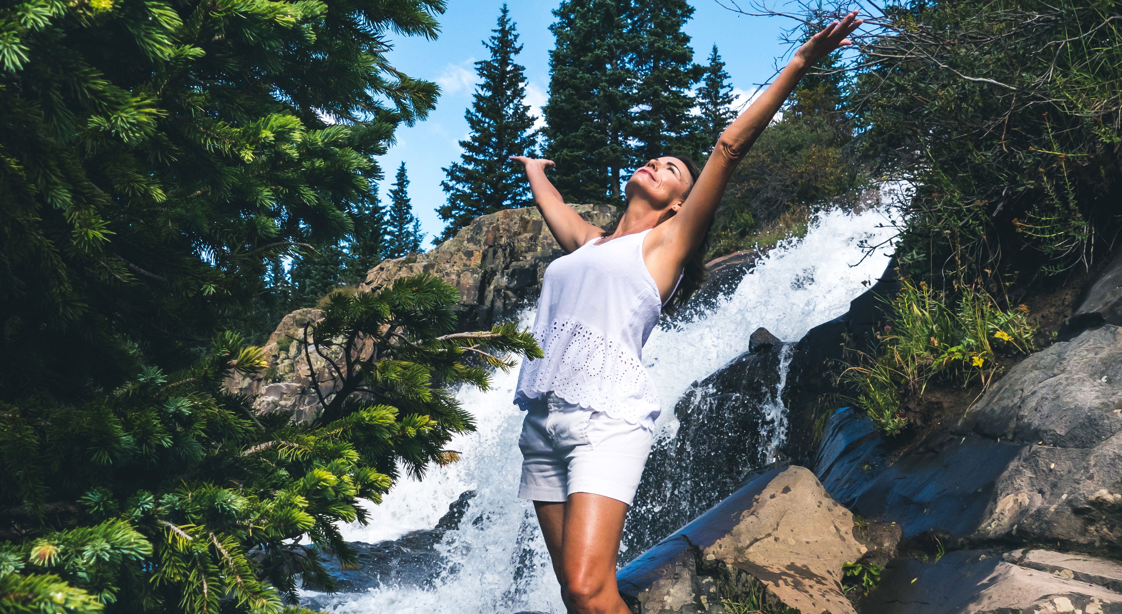 Woman by a waterfall