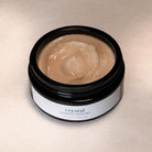 Åpen krukke som viser Crystal Cleansing Exfoliant